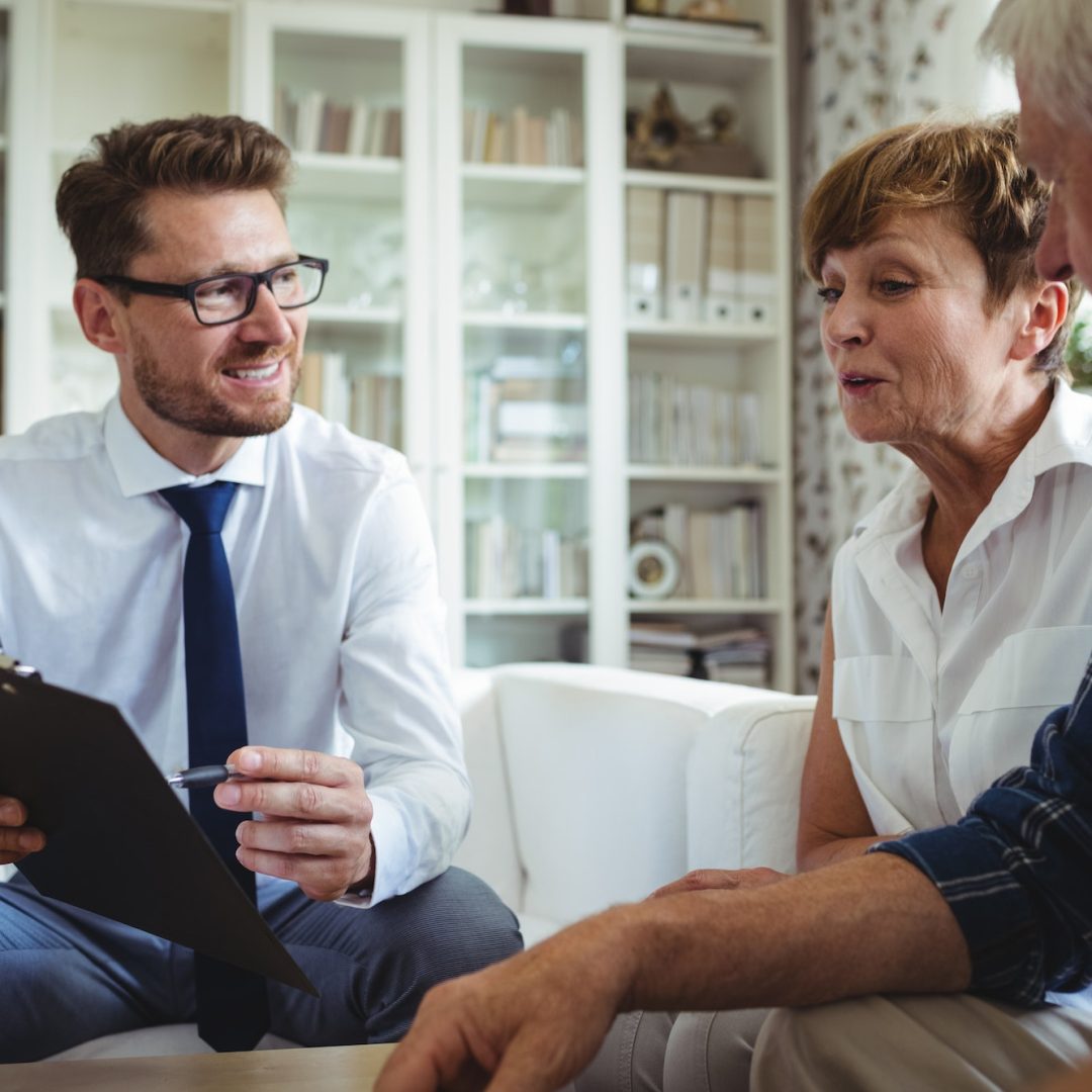 Senior couple planning their investments with financial advisor